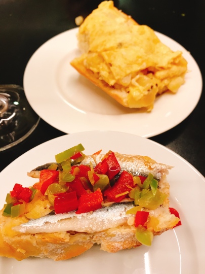 house speciality of "tortilla (omelette) on bread, and an sardine with peppers, in Pamplona Spain